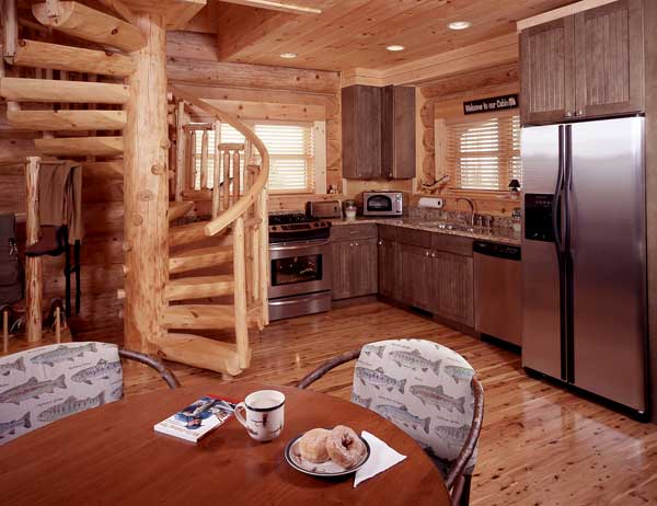 Stainless steel appliances and Australian cypress floors add modern elegance, while rustic cabinets and pine spiral staircase offer classic comfort.