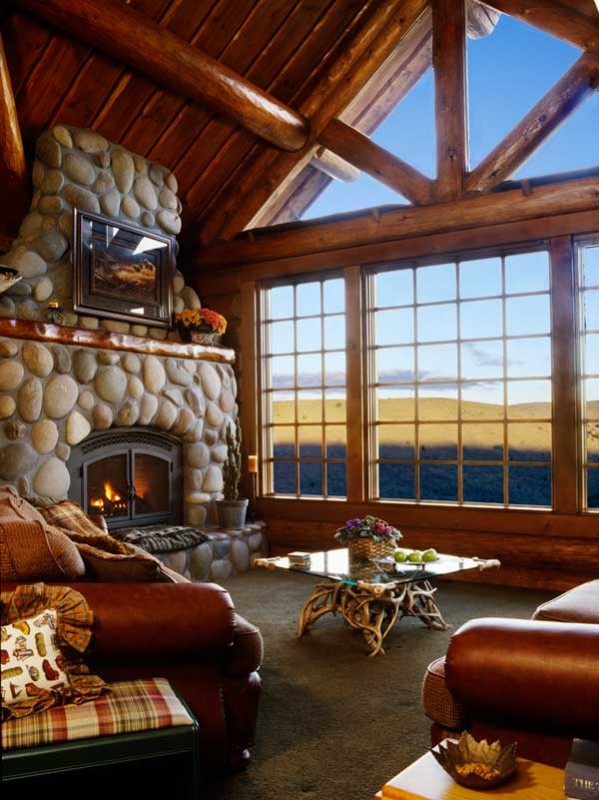 Mike considered using faux stone for his fireplace, but eventually decided on native river rock for the oversized hearth. "I wanted to build a large fireplace, without sacrificing the cozy feel of the room," he says.