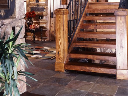 Wooden stairs leading into the tiled landing.