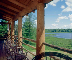 Beckoning guests to sit back and enjoy the view, these rustic garage-sale gems make this ideal porch a paradise.