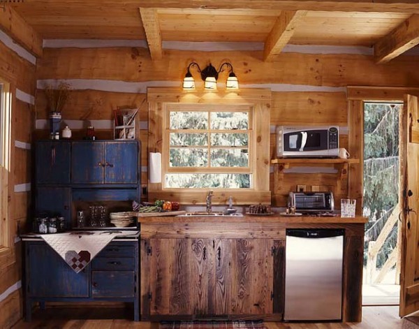 A small kitchenette in the cabin with an antique Hoosier cabinet.