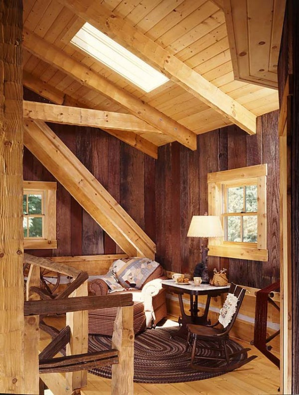 Reclaimed faded-red barn wood planks cover the stick-built walls in the loft.