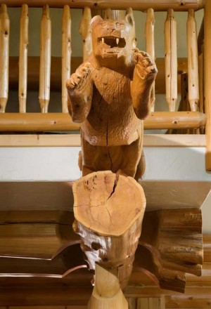 The carved panther is a signature element—West Coast Log Homes often works with wood carvers and other artisans to create a unique piece for each home they build—and how the home got the name "Panther Lodge."