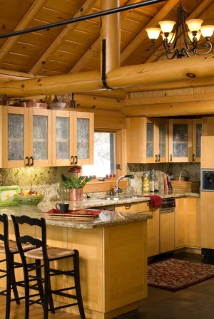 Although the rest of the original ski lodge wasn't designed for family living, the kitchen was already perfect. Bonnie found the slate flooring and granite counters to her liking. log home kitchen