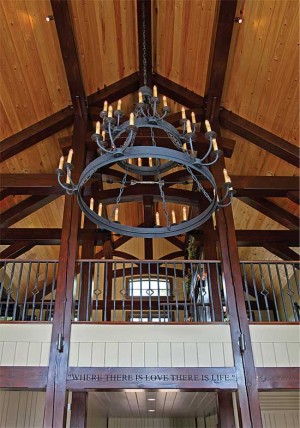 Timber-framed trusses support the home's soaring ceilings, while allowing for wide open spaces in the floor plan.