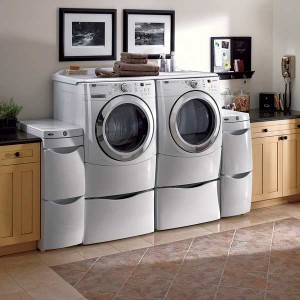 Users short and tall can sit to access front-load washers and dryers. Multilevel drawers increase the unit's functionality. Photo: Maytag Users short and tall can sit to access front-load washers and dryers. Multilevel drawers increase the unit's functionality. Photo: Maytag